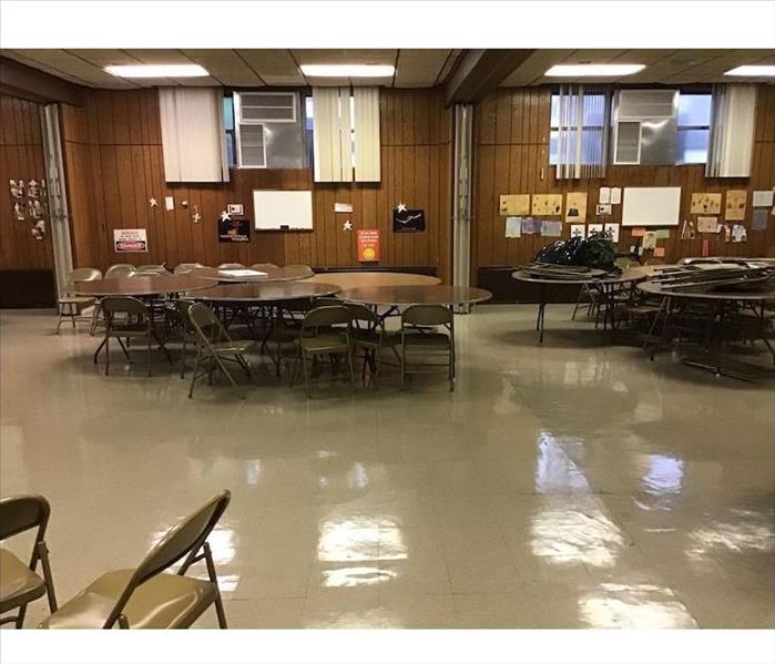 Clean cafeteria with tables and chairs