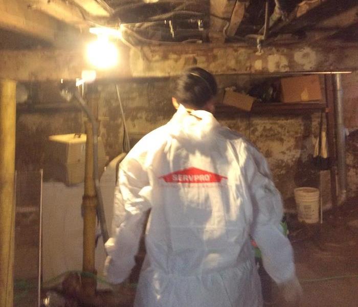 SERVPRO technician wearing PPE gear during sewage water damage mitigation 