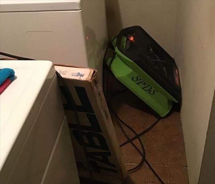 SERVPRO equipment in a laundry room. 